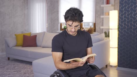 Disabled-young-man-reading-a-book-at-home.